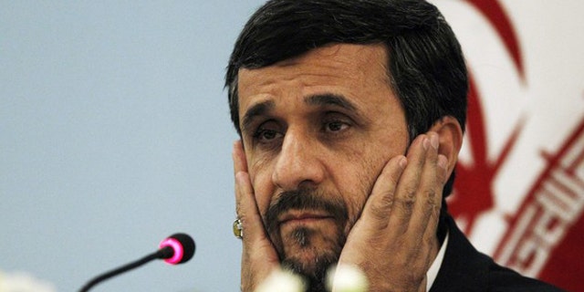 Iranian President Mahmoud Ahmadinejad addresses the media during a news conference in Istanbul December 23, 2010.