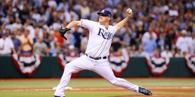 ST PETERSBURG, FL - OCTOBER 07: Jake McGee #57 of the Tampa Bay Rays pitches in the eighth inning against the Boston Red Sox during Game Three of the American League Division Series at Tropicana Field on October 7, 2013 in St Petersburg, Florida. (Photo by Brian Blanco/Getty Images)