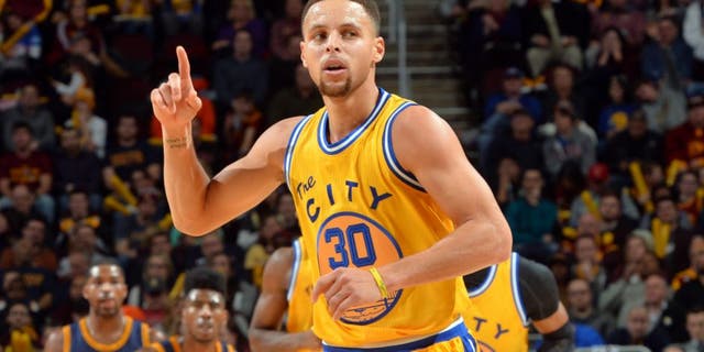CLEVELAND, OH - JANUARY 18: Stephen Curry #30 of the Golden State Warriors raises his hand during a break in the action against the Cleveland Cavaliers on January 18, 2016 at Quicken Loans Arena in Cleveland, Ohio. (Jesse D. Garrabrant/NBAE via Getty Images)