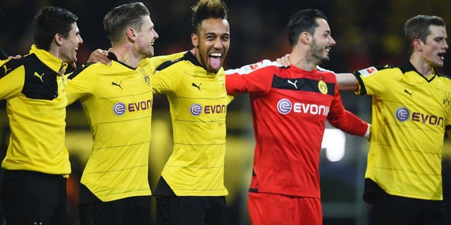 DORTMUND, GERMANY - DECEMBER 13: Pierre-Emerick Aubameyang of Borussia Dortmund (C) celebrates victory with team mates after the Bundesliga match between Borussia Dortmund and Eintracht Frankfurt at Signal Iduna Park on December 13, 2015 in Dortmund, Germany. (Photo by Lars Baron/Bongarts/Getty Images)