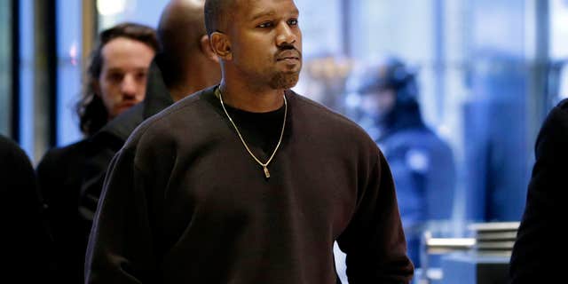 FILE - In this Dec. 13, 2016, file photo, Kanye West enters Trump Tower in New York.