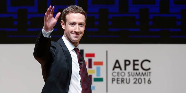 FILE - In this Saturday, Nov. 19, 2016 file photo, Mark Zuckerberg, chairman and CEO of Facebook, waves at the CEO summit during the annual Asia Pacific Economic Cooperation (APEC) forum in Lima, Peru.