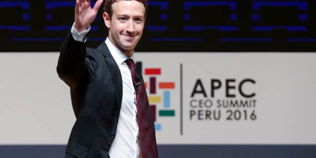 FILE - In this Saturday, Nov. 19, 2016 file photo, Mark Zuckerberg, chairman and CEO of Facebook, waves at the CEO summit during the annual Asia Pacific Economic Cooperation (APEC) forum in Lima, Peru.