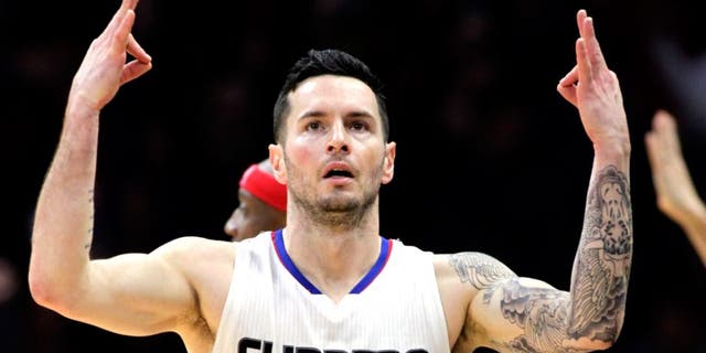 Los Angeles Clippers guard J.J. Redick (4) reacts after making a 3-point shot during the overtime period of an NBA basketball game against the Houston Rockets in Los Angeles, Monday, Jan. 18, 2016. The Clippers won 140-132 in overtime. (AP Photo/Alex Gallardo)