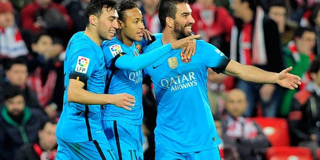 Barcelona's Brazilian forward Neymar da Silva Santos Junior (C) celebrates a goal with forward Munir El Haddadi (L) and Turkish midfielder Arda Turan during the Spanish Copa del Rey (King's Cup) football match Athletic Club de Bilbao vs FC Barcelona at the San Mames stadium in Bilbao on January 20, 2016. AFP PHOTO / ANDER GILLENEA / AFP / ANDER GILLENEA (Photo credit should read ANDER GILLENEA/AFP/Getty Images)
