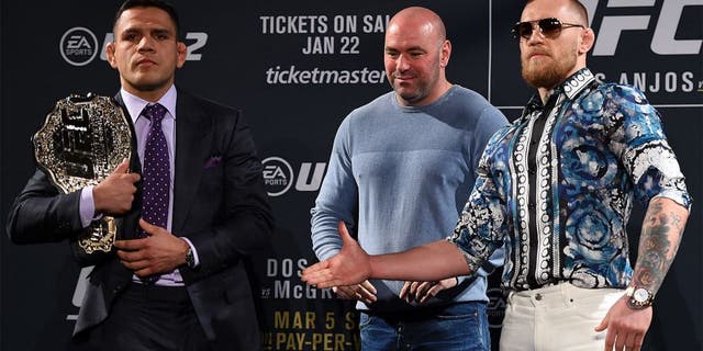 LAS VEGAS, NV - JANUARY 20: UFC President Dana White squares off Rafael dos Anjos of Brazil (L) and Conor McGregor of Ireland (R) during the UFC 197 on-sale press conference event inside MGM Grand Hotel & Casino on January 20, 2016 in Las Vegas, Nevada. (Photo by Jeff Bottari/Zuffa LLC/Zuffa LLC via Getty Images)