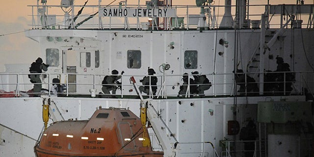 Jan. 21: South Korean naval special forces prepare to rescue crew members from Somali pirates on cargo ship Samho Jewelry in the Arabian Sea.