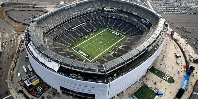 In this Dec. 1, 2013, photo, MetLife Stadium is seen in an aerial photo in East Rutherford, N.J. Super Bowl tickets are tough to acquire. There's only so many seats in the stadium, and several are filled by corporations and sponsors. Then, when you factor in price and logistics, it makes it all that more difficult, even with the rise of the secondary market on the internet. Things won't be any easier this year, as the NFL houses its first cold-weather Super Bowl on Feb. 2 at MetLife Stadium with the New York skyline as a backdrop. (AP Photo/Mark Lennihan)