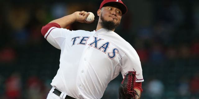 ARLINGTON, TX - SEPTEMBER 18: Yovani Gallardo #49 of the Texas Rangers throws in the first inning Seattle Mariners at Global Life Park in Arlington on September 18, 2015 in Arlington, Texas. (Photo by Rick Yeatts/Getty Images)