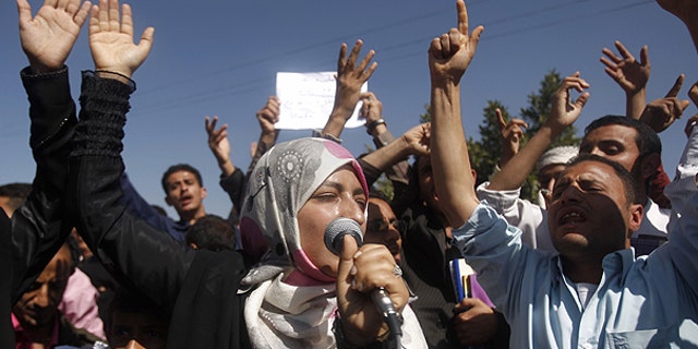 Jan. 22: Yemeni students chant slogans calling on their president Ali Abdullah Saleh to leave the government and follow Tunisian ousted President Zine El Abidine Ben Ali into exile during a protest in Sanaa, Yemen.