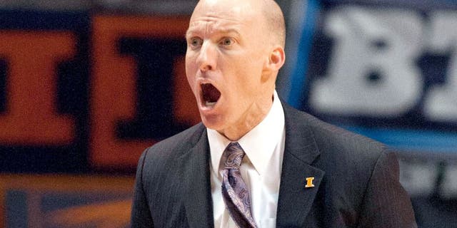 Jan 18, 2014; Champaign, IL, USA; Illinois Fighting Illini head coach John Groce yells at the referees during the game against the Michigan State Spartans at State Farm Center. The Michigan State Spartans beat the Illinois Fighting Illini 78-62. Mandatory Credit: Trevor Ruszkowksi-USA TODAY Sports