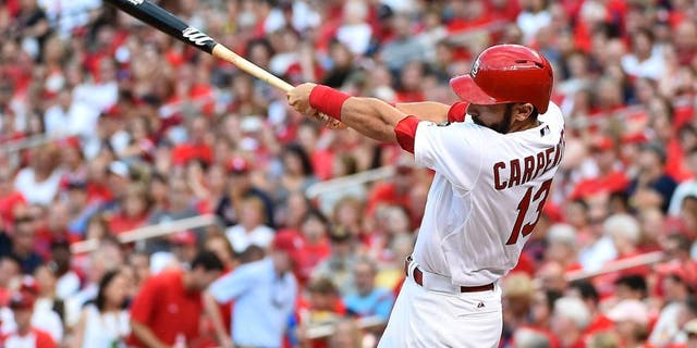 Jul 30, 2015; St. Louis, MO, USA; St. Louis Cardinals third baseman Matt Carpenter (13) connects for a three-run home run off of Colorado Rockies starting pitcher Chris Rusin (not pictured) in the second inning at Busch Stadium. Mandatory Credit: Jasen Vinlove-USA TODAY Sports