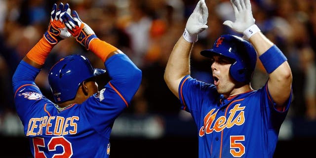 NEW YORK, NY - OCTOBER 12: Yoenis Cespedes #52 of the New York Mets celebrates with David Wright #5 after hitting a three run home run against Alex Wood #57 of the Los Angeles Dodgers in the fourth inning during game three of the National League Division Series at Citi Field on October 12, 2015 in New York City. (Photo by Mike Stobe/Getty Images)