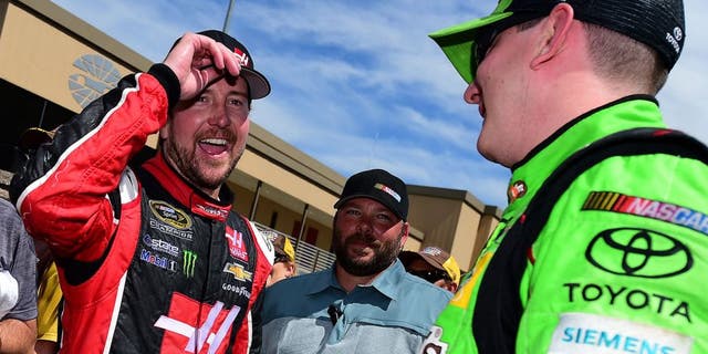 SONOMA, CA - JUNE 28: Kurt Busch, driver of the #41 Haas Automation Chevrolet, congratulates Kyle Busch, driver of the #18 M&M's Crispy Toyota, after winning the NASCAR Sprint Cup Series Toyota/Save Mart 350 at Sonoma Raceway on June 28, 2015 in Sonoma, California. (Photo by Jared C. Tilton/Getty Images)