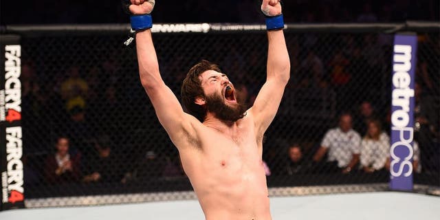 PHOENIX, AZ - DECEMBER 13: Bryan Barberena celebrates after defeating Joe Ellenberger in their lightweight fight during the UFC Fight Night event at the U.S. Airways Center on December 13, 2014 in Phoenix, Arizona. (Photo by Josh Hedges/Zuffa LLC/Zuffa LLC via Getty Images)