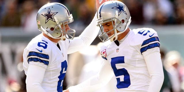 Oct 20, 2013; Philadelphia, PA, USA; Dallas Cowboys place kicker Dan Bailey (5) celebrates kicking a field goal with holder Chris Jones (6) during the second quarter against the Philadelphia Eagles at Lincoln Financial Field. Mandatory Credit: Howard Smith-USA TODAY Sports