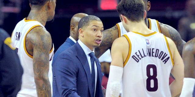 Jan 23, 2016; Cleveland, OH, USA; Cleveland Cavaliers head coach Tyronn Lue (C) huddles with his team during the fourth quarter against the Chicago Bulls at Quicken Loans Arena. The Bulls won 96-83. Mandatory Credit: Ken Blaze-USA TODAY Sports