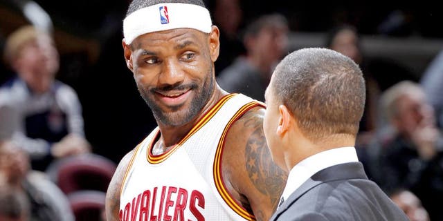CLEVELAND, OH - NOVEMBER 23: LeBron James #23 and assistant coach Tyronn Lue of the Cleveland Cavaliers talk during the game against the Orlando Magic on November 23, 2015 at Quicken Loans Arena in Cleveland, Ohio. NOTE TO USER: User expressly acknowledges and agrees that, by downloading and or using this Photograph, user is consenting to the terms and condition of the Getty Images License Agreement. (Photo by Rocky Widner/Getty Images)