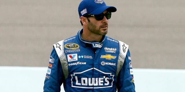 HOMESTEAD, FL - NOVEMBER 21: Jimmie Johnson, driver of the #48 Lowe's Chevrolet, walks on pit road during practice for the NASCAR Sprint Cup Series Ford EcoBoost 400 at Homestead-Miami Speedway on November 21, 2015 in Homestead, Florida. (Photo by Sean Gardner/Getty Images)