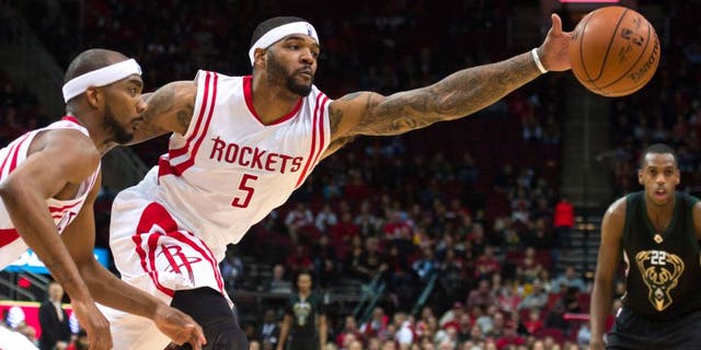 Jan 22, 2016; Houston, TX, USA; Houston Rockets center Josh Smith (5) stretches for a rebound during the second half against the Milwaukee Bucks at the Toyota Center. The Rockets defeat the Bucks 102-98. Mandatory Credit: Jerome Miron-USA TODAY Sports