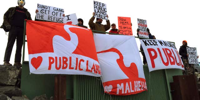 Demonstrators gather near a national wildlife refuge to protest against a group occupying the land Saturday, Jan. 23, 2016, near in Burns, Ore.