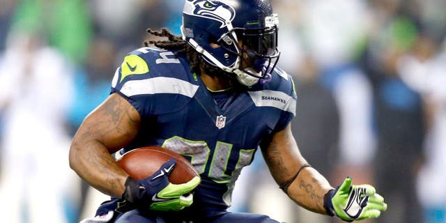 SEATTLE, WA - JANUARY 10: Marshawn Lynch #24 of the Seattle Seahawks runs the ball against the Carolina Panthers during the 2015 NFC Divisional Playoff game at CenturyLink Field on January 10, 2015 in Seattle, Washington. (Photo by Otto Greule Jr/Getty Images)
