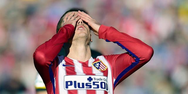 Atletico Madrid's French forward Antoine Griezmann reacts after missing a goal during the Spanish league football match Club Atletico de Madrid vs Sevilla FC at the Vicente Calderon stadium in Madrid on January 24, 2016. AFP PHOTO / JAVIER SORIANO / AFP / JAVIER SORIANO (Photo credit should read JAVIER SORIANO/AFP/Getty Images)