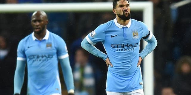 MANCHESTER, ENGLAND - DECEMBER 12: Gael Clichy of Manchester City shows dejection after conceding the first goal to Swansea during the Barclays Premier League match between Manchester City and Swansea City at Etihad Stadium on December 12, 2015 in Manchester, United Kingdom. (Photo by Michael Regan/Getty Images)