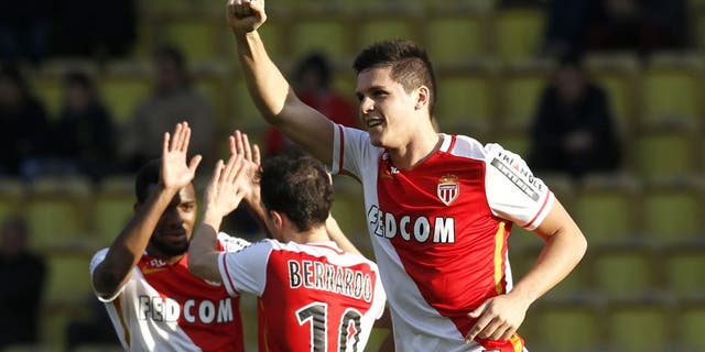 Monaco's Argentinian forward Guido Carrillo (R) celebrates after scoring a goal during the French L1 football match Monaco (ASM) vs Toulouse (TFC) on January 24, 2016 at the Louis II Stadium in Monaco. AFP PHOTO / VALERY HACHE / AFP / VALERY HACHE (Photo credit should read VALERY HACHE/AFP/Getty Images)