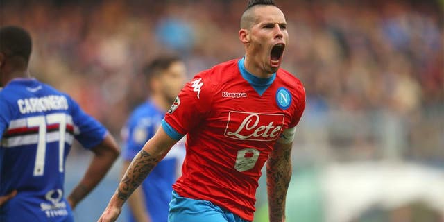 Napoli's midfielder Marek Hamsik from Slovakia celebrates after scoring during the Italian Serie A football match Sampdoria Vs Napoli on January 24, 2016 at 'Luigi Ferraris Stadium' in Genoa. AFP PHOTO / MARCO BERTORELLO / AFP / MARCO BERTORELLO (Photo credit should read MARCO BERTORELLO/AFP/Getty Images)