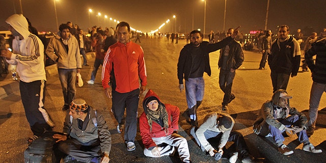 Jan. 26: Protesters stop traffic in the middle of a bridge over the Nile river during clashes in downtown Cairo, Egypt.