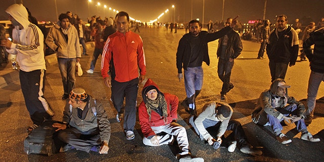 Jan. 26: Protesters stop traffic in the middle of a bridge over the Nile river during clashes in downtown Cairo, Egypt.