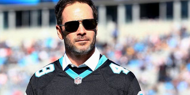 CHARLOTTE, NC - DECEMBER 14: Nascar driver Jimmie Johnson helped pound the drum for the Carolina Panthers before their game against the Tampa Bay Buccaneers at Bank of America Stadium on December 14, 2014 in Charlotte, North Carolina. (Photo by Streeter Lecka/Getty Images)