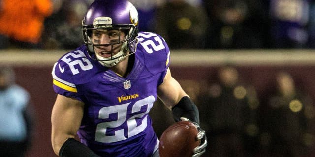 Dec 27, 2015; Minneapolis, MN, USA; Minnesota Vikings safety Harrison Smith (22) returns an interception for a touchdown during the second quarter against the New York Giants at TCF Bank Stadium. Mandatory Credit: Brace Hemmelgarn-USA TODAY Sports