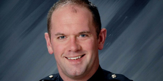 This file photo provided by the Indianapolis Metropolitan Police Department shows Officer David Moore.