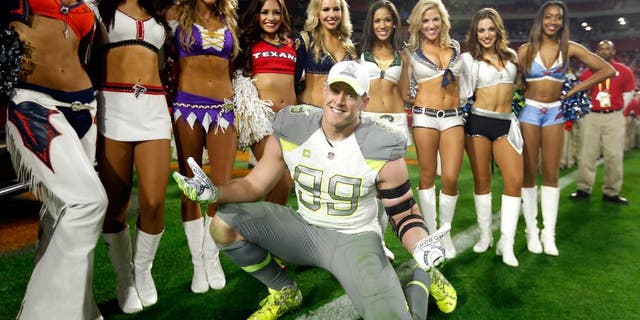 GLENDALE, AZ - JANUARY 25: Team Carter defensive end J.J. Watt #99 of the Houston Texans poses with cheerleaders after the 2015 Pro Bowl at University of Phoenix Stadium on January 25, 2015 in Glendale, Arizona. (Photo by Christian Petersen/Getty Images)