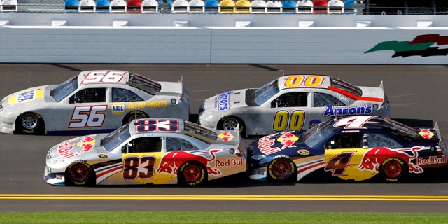 Jan. 20: NASCAR drivers Kasey Kahne (4), Brian Vickers (83), Martin Truex Jr. (56), and David Reutimann (00), participate in the afternoon bump-drafting session during auto racing testing at Daytona International Speedway in Daytona Beach, Fla.