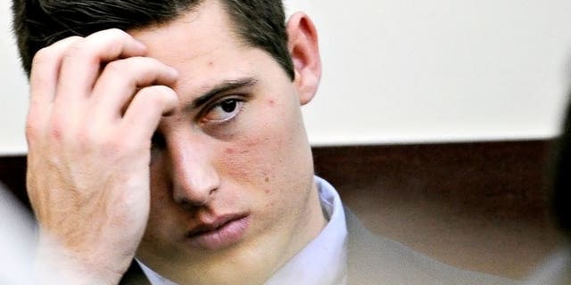 Brandon Vandenburg looks at the jury as Judge Wilkins reads the charges during his trial on Tuesday, Jan. 27, 2015 in Nashville, Tenn. Vandenburg and Cory Batey, two former Vanderbilt football players, are each charged with five counts of aggravated rape and two counts of aggravated sexual battery. (AP Photo/The Tennessean, John Partipilo, Pool)