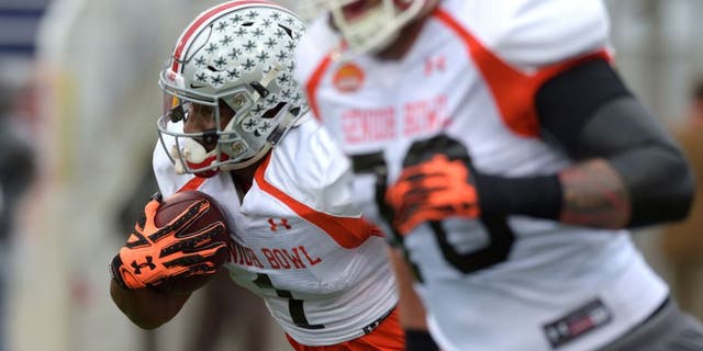 Jan 26, 2016; Mobile, AL, USA; North squad wide receiver Braxton Miller of Ohio State (1) runs the ball after a catch during Senior Bowl practice at Ladd-Peebles Stadium. Mandatory Credit: Glenn Andrews-USA TODAY Sports