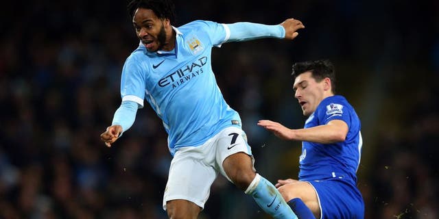 MANCHESTER, ENGLAND - JANUARY 27: Raheem Sterling of Manchester City is tackled by Gareth Barry of Everton during the Capital One Cup Semi Final, second leg match between Manchester City and Everton at the Etihad Stadium on January 27, 2016 in Manchester, England. (Photo by Alex Livesey/Getty Images)