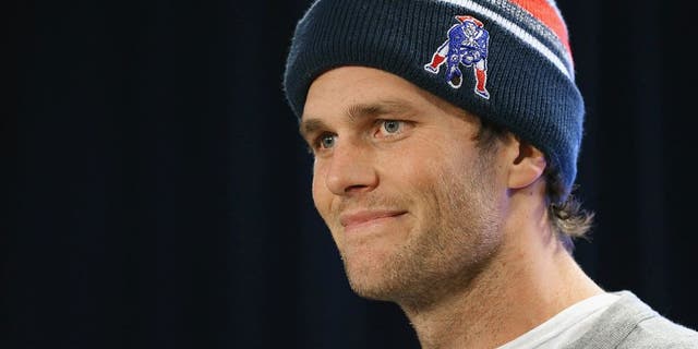 FOXBORO, MA - JANUARY 22: New England Patriots quarterback Tom Brady talks to the media during a press conference to address the under inflation of footballs used in the AFC championship game at Gillette Stadium on January 22, 2015 in Foxboro, Massachusetts. (Photo by Maddie Meyer/Getty Images)