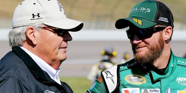KANSAS CITY, KS - OCTOBER 18: Dale Earnhardt Jr., driver of the #88 Halo 5: Master Chief Chevrolet, talks with Rick Hendrick, owner of Hendrick Motorsports, on the grid prior to the NASCAR Sprint Cup Series Hollywood Casino 400 at Kansas Speedway on October 18, 2015 in Kansas City, Kansas. (Photo by Jerry Markland/Getty Images)