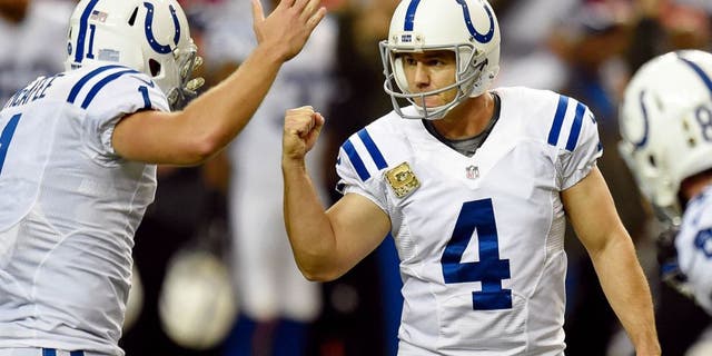 Nov 22, 2015; Atlanta, GA, USA; Indianapolis Colts place kicker Adam Vinatieri (4) reacts with punter Pat McAfee (1) after kicking the go ahead field goal against the Atlanta Falcons during the fourth quarter at the Georgia Dome. The Colts defeated the Falcons 24-21. Mandatory Credit: Dale Zanine-USA TODAY Sports