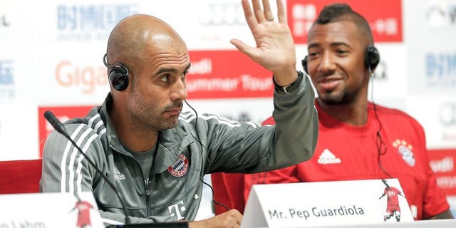 BEIJING, CHINA - JULY 17: Head coach Pep Guardiola of Bayern gestures with Jerome Boateng during the a press conference at National Stadium in day 1 of the FC Bayern Audi China Summer Pre-Season Tour on July 17, 2015 in Beijing, China. (Photo by Lintao Zhang/Getty Images)