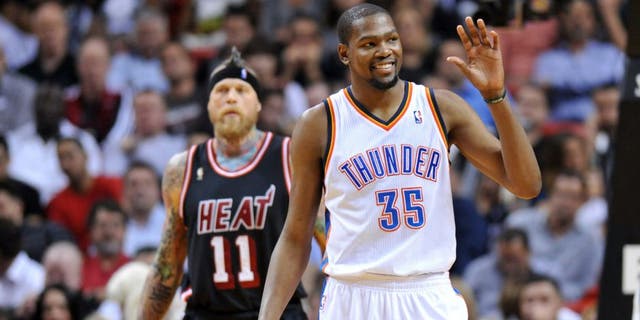 Jan 29, 2014; Miami, FL, USA; Oklahoma City Thunder small forward Kevin Durant (35) reacts in front of Miami Heat power forward Chris Andersen (11) during the second half at American Airlines Arena. Mandatory Credit: Steve Mitchell-USA TODAY Sports