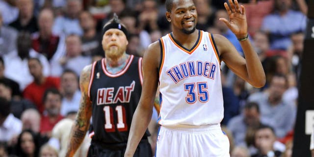 Jan 29, 2014; Miami, FL, USA; Oklahoma City Thunder small forward Kevin Durant (35) reacts in front of Miami Heat power forward Chris Andersen (11) during the second half at American Airlines Arena. Mandatory Credit: Steve Mitchell-USA TODAY Sports