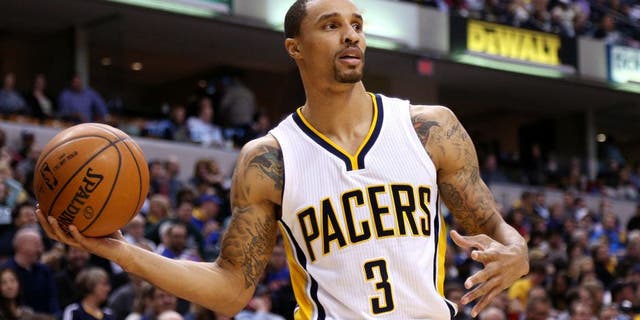 Jan 29, 2015; Indianapolis, IN, USA; Indiana Pacers guard George Hill (3) looks to make a pass against the New York Knicks at Bankers Life Fieldhouse. Indiana defeats New York 103-82. Mandatory Credit: Brian Spurlock-USA TODAY Sports