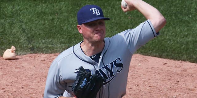 TORONTO, CANADA - JULY 18: Jake McGee #57 of the Tampa Bay Rays delivers a pitch in the ninth inning during MLB game action against the Toronto Blue Jays on July 18, 2015 at Rogers Centre in Toronto, Ontario, Canada. (Photo by Tom Szczerbowski/Getty Images)
