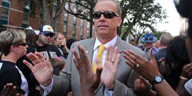 Oct 17, 2015; Hattiesburg, MS, USA; Southern Miss Golden Eagles head coach Todd Monken greets fans during Eagle Walk before their game against the UTSA Roadrunners at M.M. Roberts Stadium. Mandatory Credit: Chuck Cook-USA TODAY Sports