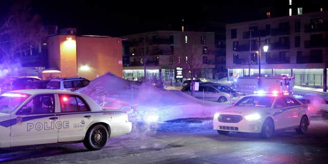 Jan. 29, 2017: Police survey the scene after deadly shooting at a mosque in Quebec City, Canada.